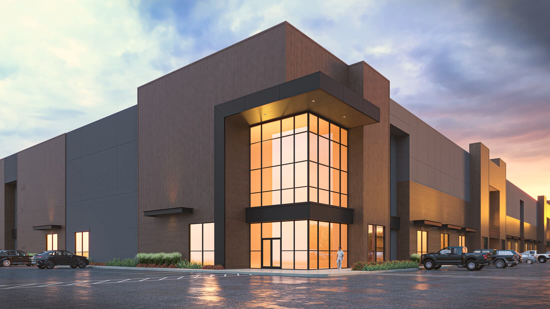 Modern commercial building at dusk clad in JC Distribution materials