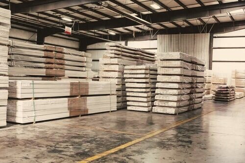 Warehouse stacks of building materials staged for distribution